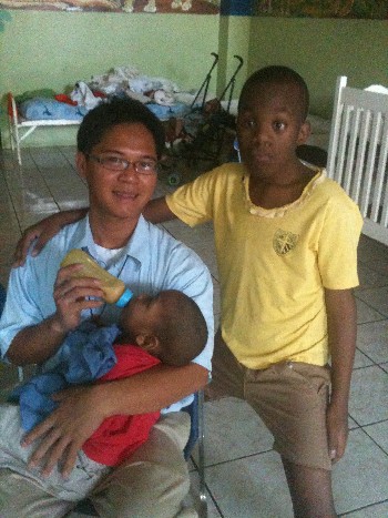 Brother feeding in the young boys part of Bethlehem Center